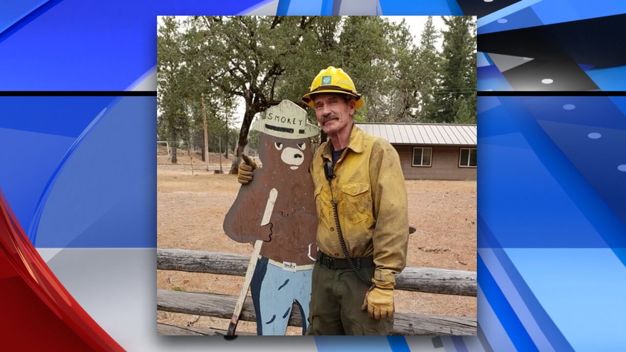Dan Steffensen with Smokey Bear sign